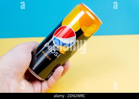 Tyumen, Russia-December 10, 2020: Pepsi mango logo close up on a yellow blue background Stock Photo