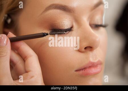 Cropped close up of a woman getting lash extensions applied Stock Photo