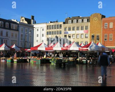 With its origins in medieval times, Northampton's Market Square continues to this day with colourful awnings over the stalls of fruit & veg. Stock Photo