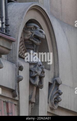 elements of architectural decorations of buildings, sculptures, mythological and religious characters on the streets in Catalonia, public places. Stock Photo