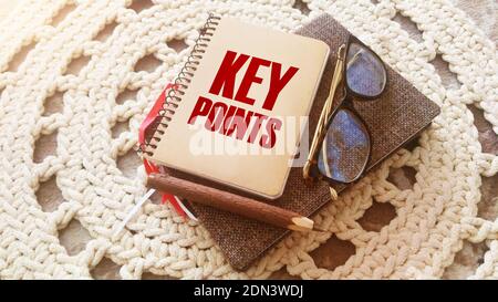 text KEY POINTs on the cover of a book, eye glasses and pen. Business education concept. Stock Photo