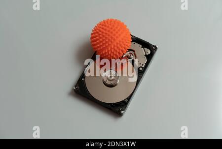 Concept, data infected by a virus. Disassembled hard drive with virus Stock Photo