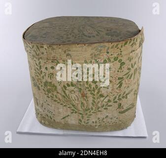 Bandbox, Hannah Davis, 1784 – 1863, Block-printed paper, wood support, newsprint lining, Yellow background, pink and deep bright pink flowers with touches of white, green leaves: carnations, butterflies, birds, roses in fairly random scattered pattern. Paper on exterior much faded: background appears to be beige with brown and green pattern. Just inside rim, well-preserved, brightly colored pieces. Printed paper label inside lid on yellow paper: 'Warranted Nailed/Band Boxes/ Manufactured by/Hannah Davis/ East Jaffrey, NH', Jaffrey, New Hampshire, USA, ca. 1855, Wallcoverings, Bandbox Stock Photo