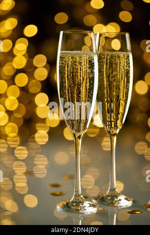 Two glasses of champagne on festive lights bokeh Stock Photo