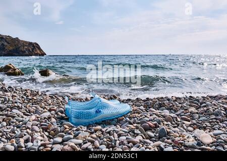 Swimming shoes for pebbly hot sale beaches