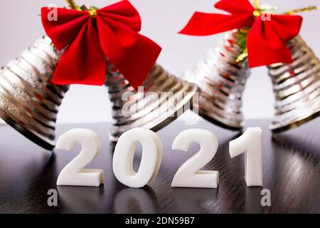 White 2021 Numbers and New Year Bells close up Stock Photo