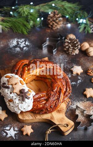 Sweet Bread Wreath decorated with stars cookies. Honey brioche garland with chocolate and nuts. Holiday recipes. Braided Bread. Cinnamon Twist Bread W Stock Photo