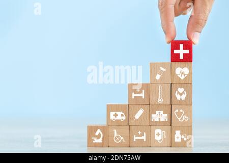 Health Insurance Concept,hand Arranging Wood Block Stacking With Icon Healthcare Medical.