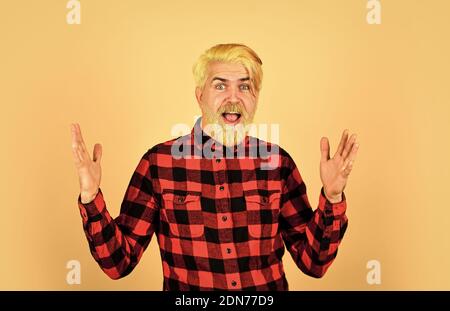 Fashion trend. Expression of inner you. Moisturise and apply beard oils. Handsome man unshaven face. Bearded man checkered shirt. Hipster dyed beard. Hairdresser and barbershop. Coloring beard. Stock Photo