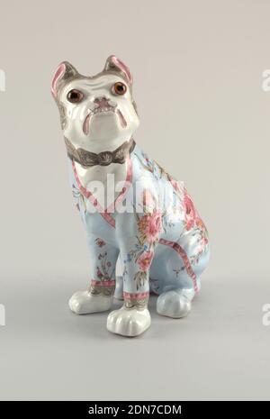 Figure of a dog, Emile Gallé, French, 1846 - 1904, Glazed earthenware, Bulldog sitting on haunches, decorated as if wearing light blue dressing gown, banded in red and embellished with predominantly red flowers, a few blue forget-me-nots and green foliage. Painted black lace cap on head tied under chin, black lace protruding from sleeves of gown above white front paws; applied glass eyes. Body predominantly fine red clay with some cream colored clay., Nancy, France, 1870–80, ceramics, Decorative Arts, Figure of a dog Stock Photo