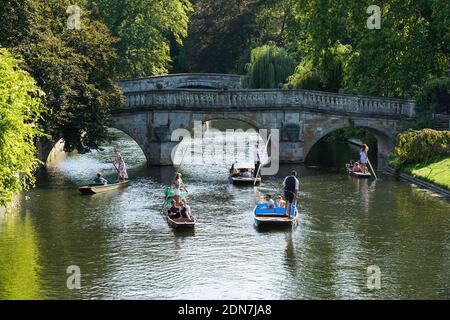 People punting on the River Cam in Cambridge, Cambridgeshire England United Kingdom UK