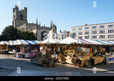 Stalls on the Market Square in Cambridge with the Great St Mary's, the University Church in the background, Cambridgeshire England United Kingdom UK Stock Photo