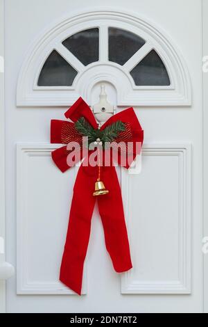 Christmas decoration on a front white door, London England United Kingdom UK Stock Photo
