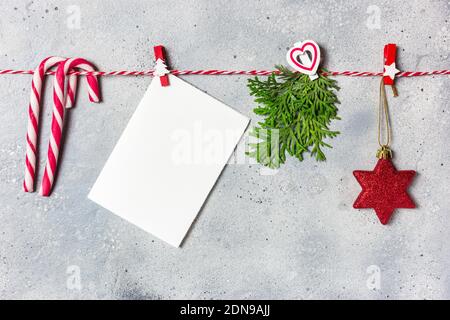 Christmas composition. Christmas ornaments and evergreen tree branches on gray stone background. Christmas, winter, new year concept. Flat lay, top vi