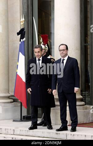 French President Francois Hollande welcomes France's former President and leader of the right-wing UMP party Nicolas Sarkozy at the Elysee Palace before attending a Unity rally ÒMarche RepublicaineÓ on January 11, 2015 in Paris in tribute to the 17 victims of a three-day killing spree by homegrown Islamists. The killings began on January 7 with an assault on the Charlie Hebdo satirical magazine in Paris that saw two brothers massacre 12 people including some of the country's best-known cartoonists, the killing of a policewoman and the storming of a Jewish supermarket on the eastern fringes of Stock Photo