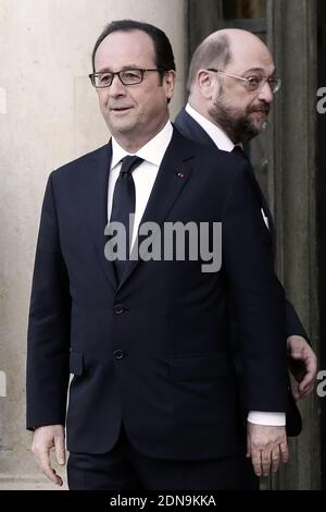 French President Francois Hollande welcomes European Parliament President Martin Schulz at the Elysee Palace before attending a Unity rally ÒMarche RepublicaineÓ on January 11, 2015 in Paris in tribute to the 17 victims of a three-day killing spree by homegrown Islamists. The killings began on January 7 with an assault on the Charlie Hebdo satirical magazine in Paris that saw two brothers massacre 12 people including some of the country's best-known cartoonists, the killing of a policewoman and the storming of a Jewish supermarket on the eastern fringes of the capital which killed 4 local resi Stock Photo