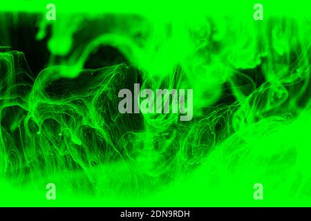 Abstract green acrylic ink background. Dramatic green wave in black. Stock Photo