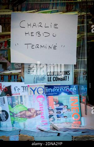 A board reading 'Charlie Sold Out' has been installed in the window of a newsstand in Paris, France on January 14, 2015. All the copies of the magazine sold out across France within minutes of it being released and a further two million editions are set to be printed. It is the first edition since the terror attack at its office saw 12 people murdered. Photo by Audrey Poree/ABACAPRESS.COM Stock Photo