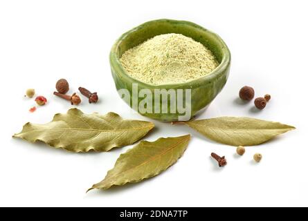 bowl of dried plant and spices powder isolated on white background Stock Photo