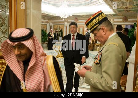 President of Ukraine, Petro Poroshenko (C) arrives at the Diwan royal palace to attend a ceremony with officials from all over the world offering their condolences on the death of the late Saudi King, Abdullah bin Abdulaziz al-Saud, as Saudi Prince Turki Al Faycal (L) looks on, in Riyadh, Saudi Arabia, 24 January 2015. Photo Pool by Yoan Valat/ABACAPRESS.COM Stock Photo