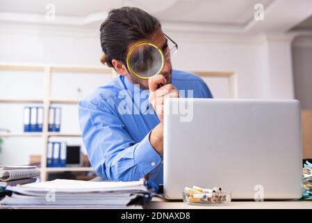 Young bookkeper in budget planning concept Stock Photo