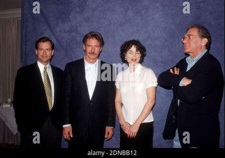 Stars of 'Sabrina,' Greg Kinnear, Harrison Ford, Julia Ormond, and Director Sydney Pollock, circa 1995 / File Reference # 34000-1349PLTHA Stock Photo