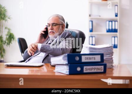 Senior male businessman employee working in the office Stock Photo