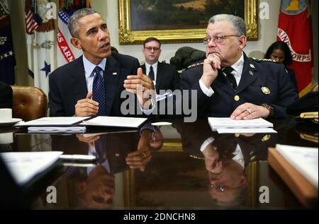 U.S. President Barack Obama (L) speaks as Commissioner of the Philadelphia Police Department Charles Ramsey (R) during a meeting to receive his Task Force on 21st Century Policing's interim report in the Roosevelt Room of the White House March 2, 2015 in Washington, DC, USA. President Obama met with the task force "to discuss their recommendations on how to strengthen community policing and strengthen trust among law enforcement officers and the communities they serve." Photo by Alex Wong/Pool/ABACAPRESS.COM Stock Photo