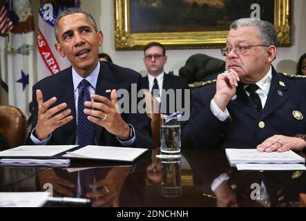U.S. President Barack Obama (L) speaks as Commissioner of the Philadelphia Police Department Charles Ramsey (R) during a meeting to receive his Task Force on 21st Century Policing's interim report in the Roosevelt Room of the White House March 2, 2015 in Washington, DC, USA. President Obama met with the task force "to discuss their recommendations on how to strengthen community policing and strengthen trust among law enforcement officers and the communities they serve." Photo by Alex Wong/Pool/ABACAPRESS.COM Stock Photo