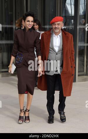 Farida Khelfa and Christian Louboutin arriving for the Louis Vuitton  Fall-Winter 2015/2016 Ready-To