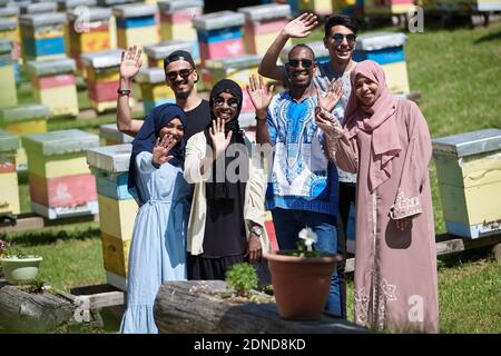 people group visiting local honey production farm Stock Photo