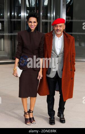 Farida Khelfa and Christian Louboutin arriving for the Louis