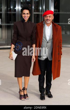 Farida Khelfa and Christian Louboutin arriving for the Louis Vuitton  Fall-Winter 2015/2016 Ready-To