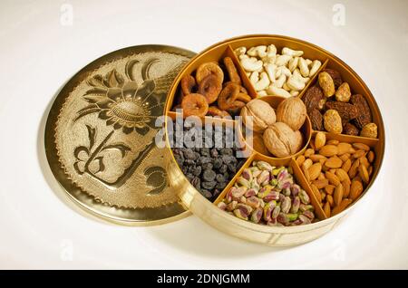 Dried Fruit Almonds, Green Pistachio, Walnut with Shell, dried Fig and Cashew nuts in container Top angle. Studio Shot Stock Photo