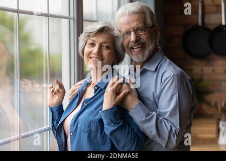 Portrait of happy middle aged family couple. Stock Photo