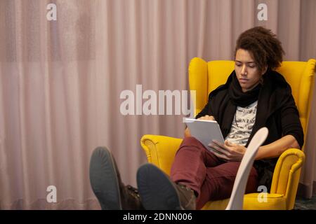 Man using digital tablet Stock Photo