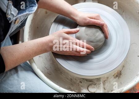 Womans hands modeling clay Stock Photo