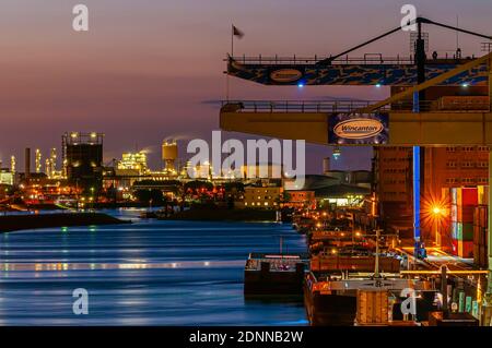 Mannheim, Germany. August 24th, 2010. Terminal Container of Mannheim and industrial area of Ludwigshafen on the background. River port on the Rhine. Stock Photo