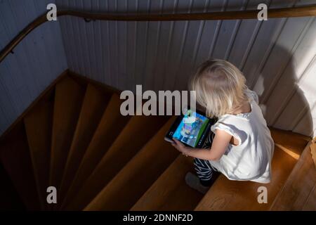 Girl using digital tablet Stock Photo