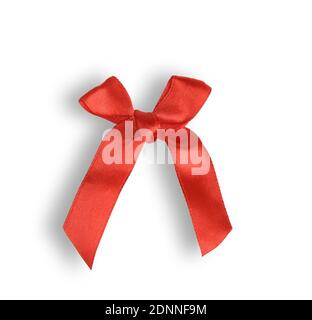 knotted bow made of red silk ribbon isolated on white background, close up Stock Photo