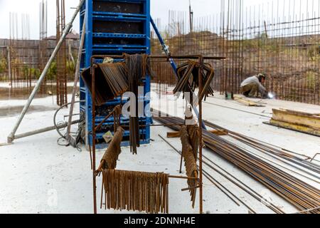 Metal structures from reinforcement for pouring concrete in monolithic construction. Construction site. Improving the reliability of the construction Stock Photo