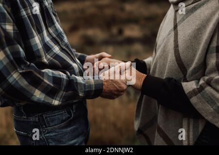 Senior couple holding hands Stock Photo