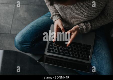 Womans hands using cell phone Stock Photo