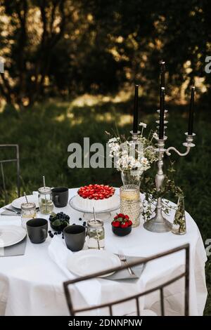 Cake and drinks on table Stock Photo