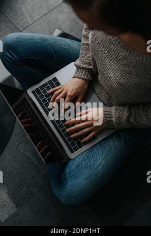 Womans hands using laptop Stock Photo