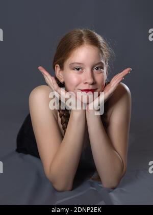 Redhead Teen Majorette Girl with Pigtails Posing in Studio Stock Photo