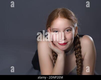 Redhead Teen Majorette Girl with Pigtails Posing in Studio Stock Photo