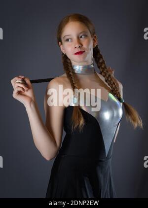 Redhead Teen Majorette Girl with Pigtails Posing in Studio Stock Photo