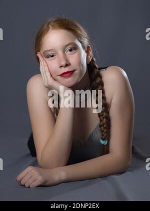 Redhead Teen Majorette Girl with Pigtails Posing in Studio Stock Photo