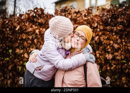 Mother with daughter hugging Stock Photo